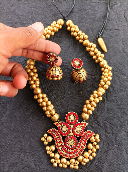 Yaalz Traditional Heavy Terracotta Art Neckset & Matching Jumka earrings in gold and Red Colours.