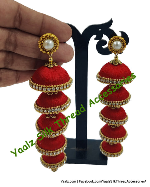 Yaalz Silk Thread 5 Layer Jhumka In Orange Color