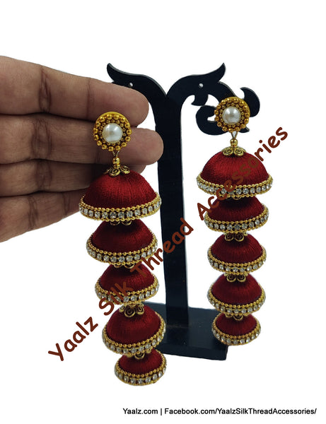 Yaalz Silk Thread 5 Layer Jhumka In Orange Color