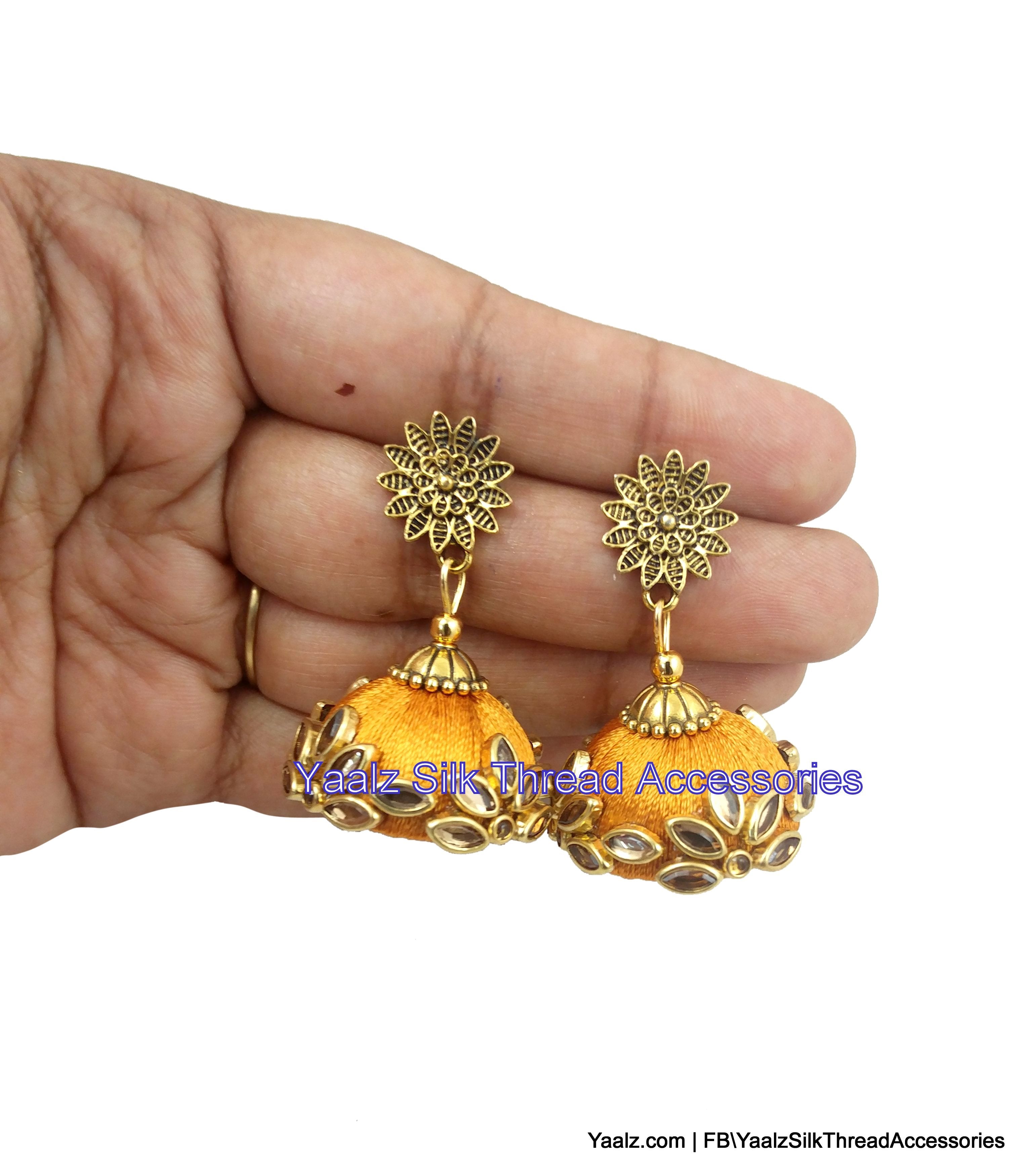 Yaalz Kundan Stone Jhumka Earrings In Gold Color