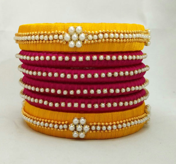 silk thread Bangle Earring Jumka-Yaalz Pearl Worked Bangle Set in Dark Pink And Mango Yellow Colors-YAALZ
